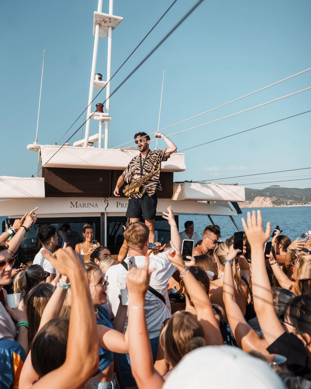 Picture of travellers having lots of fun on a boat party in ibiza