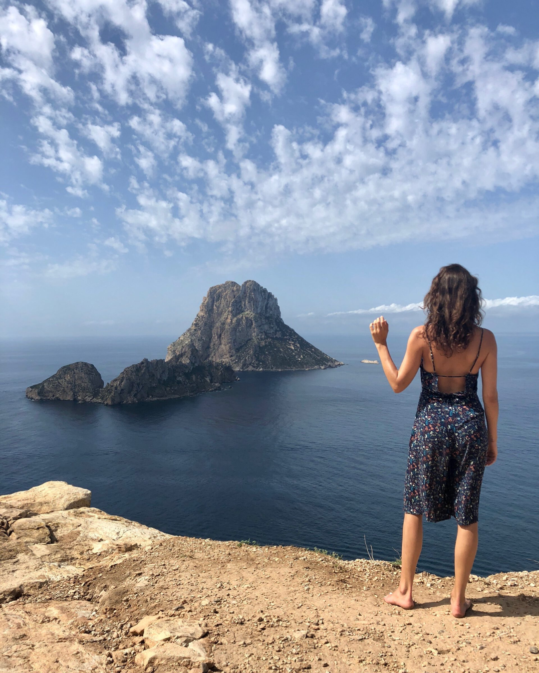 Picture of a woman enjoying the gorgeous Ibiza view